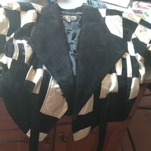Gold and black jacket with black suede tie in fron